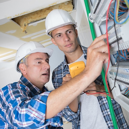 Two persons working in construction industry