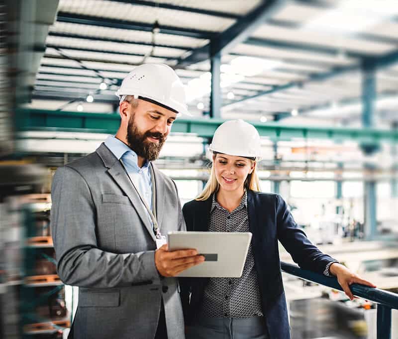 Two Person Discussing about Construction Staffing